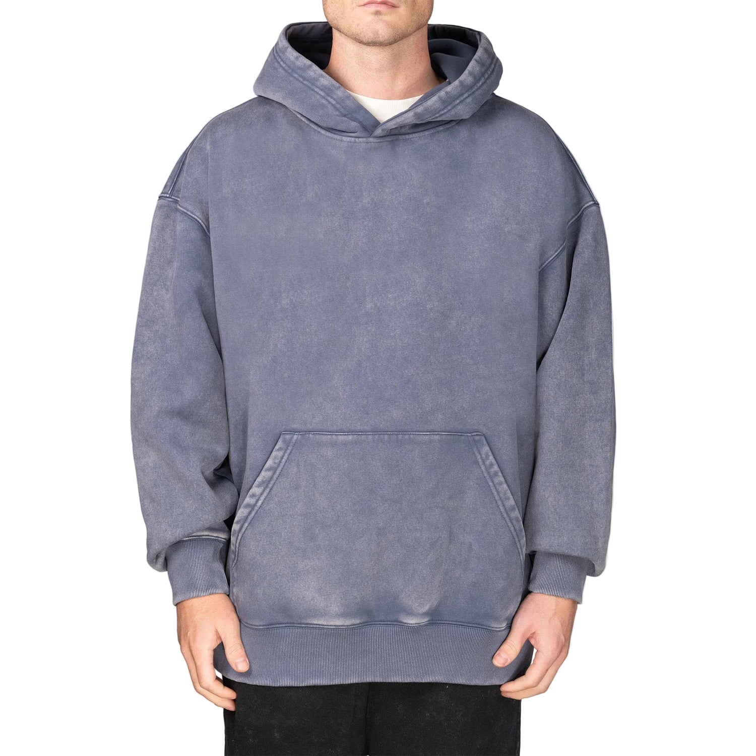 Person wearing a gray hoodie on a plain background
